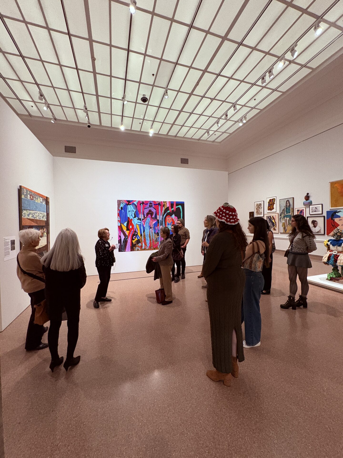 a group of person in a museum gallery